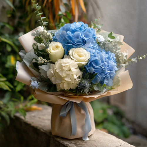A Symphony of Calm: Hydrangeas in Blue, Roses in White